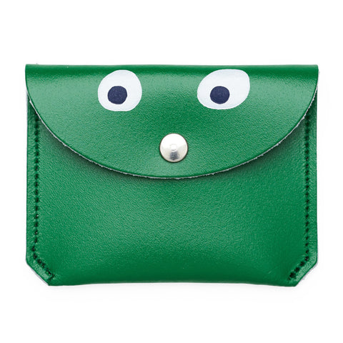 Mini green purse with popper close featuring a printed googly eye design.