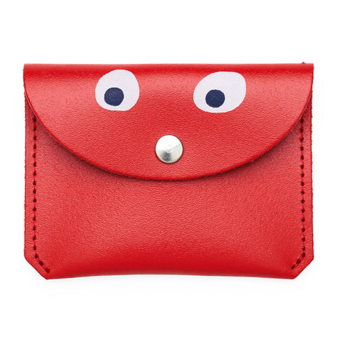 Mini red purse with popper close featuring a printed googly eye design.