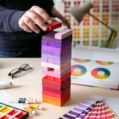 The gradient tower game being played in a colourful room.