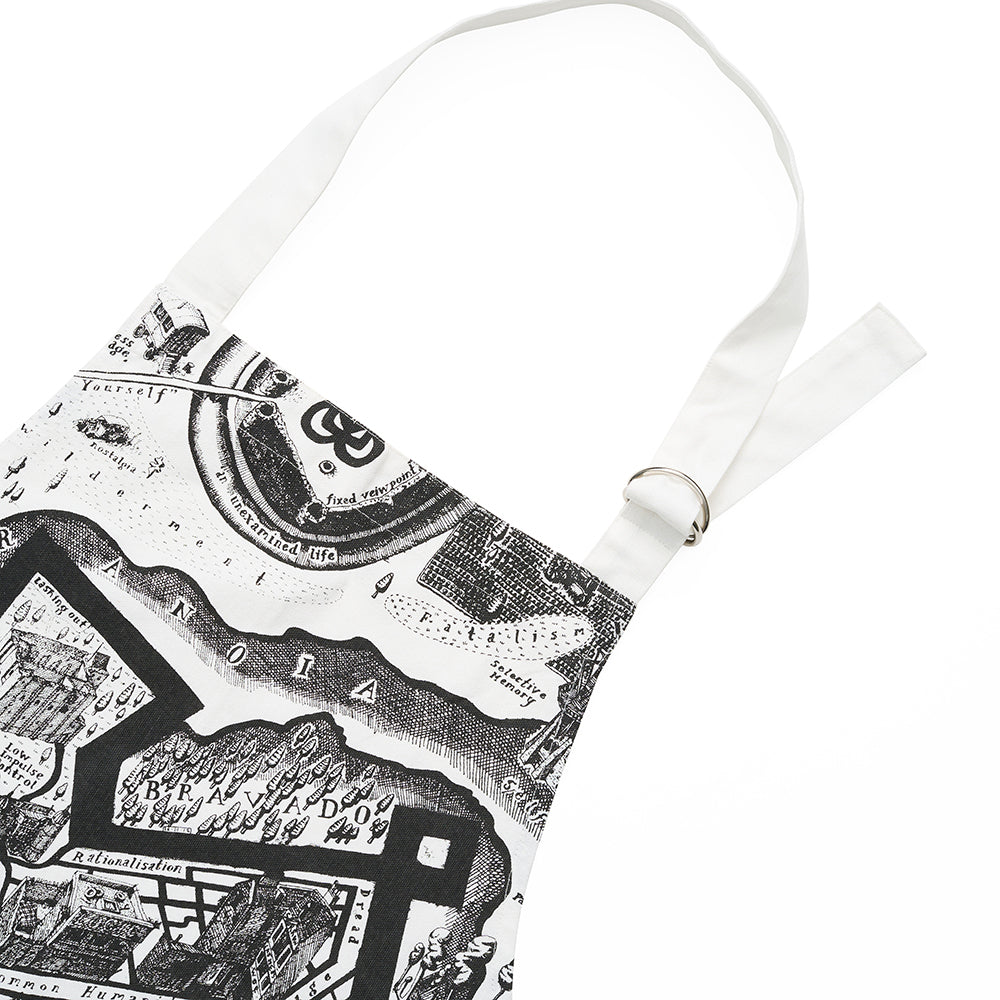 Close up of black and white apron with illustrated map design on a white background