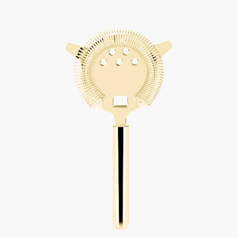 A gold cocktail strainer.