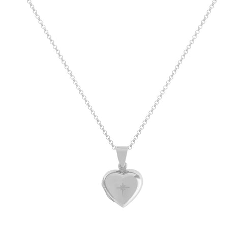 Silver heart shaped locket with engraved star on a silver chain necklace. 