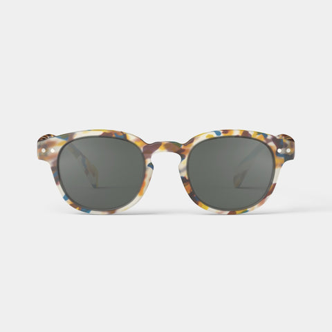A pair of children's sunglasses with a multicolour tortoiseshell frame with specks of blue, yellow and cream.