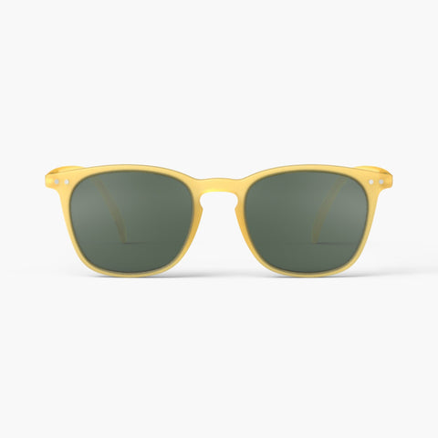 A pair of sunglasses in a bright yellow frame.