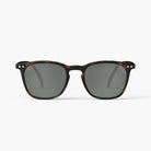 A pair of sunglasses in a dark brown tortoiseshell frame.