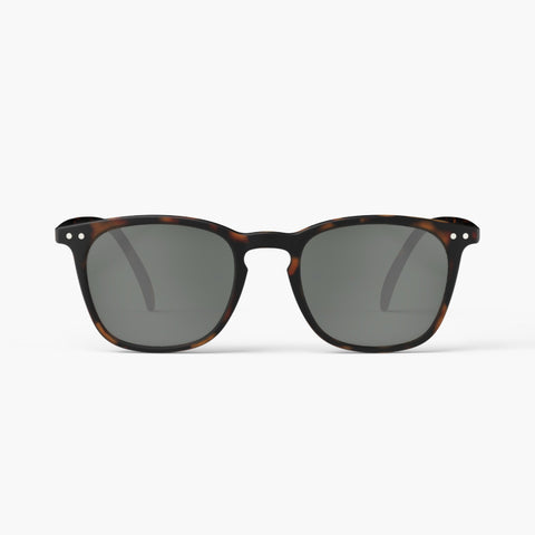 A pair of sunglasses in a dark brown tortoiseshell frame.