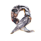 Reverse of silk scarf rolled and styled.