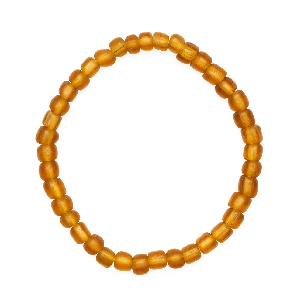 Round amber bead bracelet on a white background