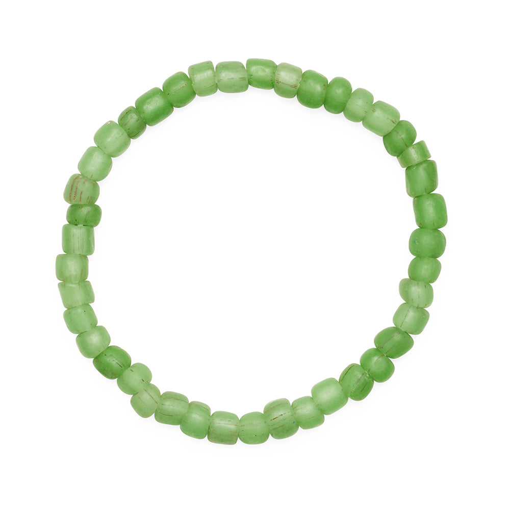 Green beaded bracelet on a white background