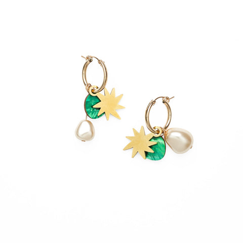 A pair of gold hoops with a gold brass star, emerald green mother of pearl drop and a glass pearl hanging on each earring.