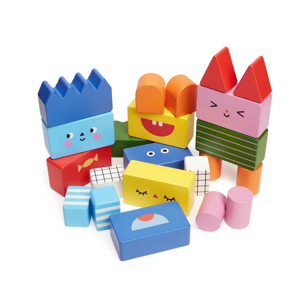 Colorful wooden blocks with cartoon faces on a white background