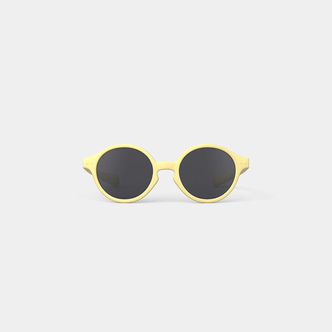 A pair of children's sunglasses in a yellow frame.
