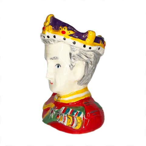 King Charles III ceramic egg cup bust with red uniform and crown, side view. 