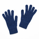 Pair of knitted dark blue gloves on a white background
