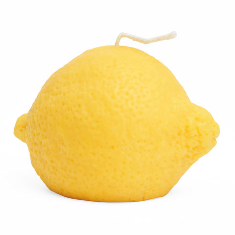 Yellow lemon shaped candle.