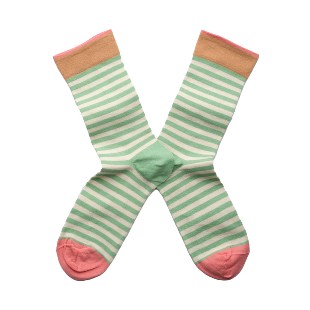 Pair of green and white striped socks with pink accents on a white background