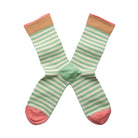 Pair of green and white striped socks with pink accents on a white background