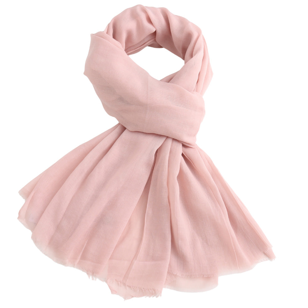 Pink scarf against a white background