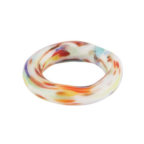 A multicoloured glass ring, mainly in ivory.