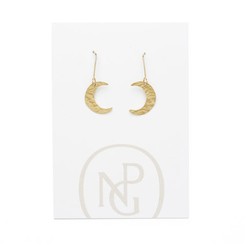 A pair of gold hook earrings with hanging hammered brass moon pendants against a card backing with National Portrait Gallery logo.