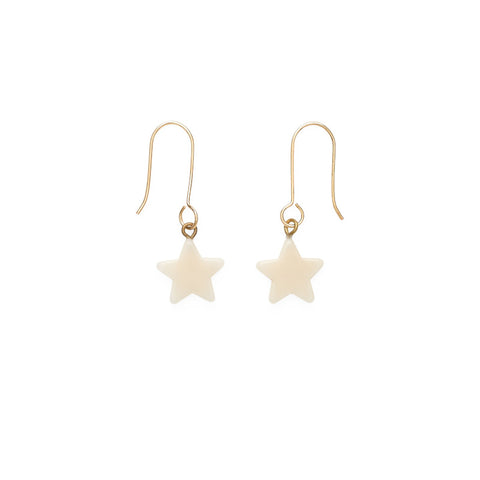 A pair of gold earring hooks each with a hanging white star pendant.