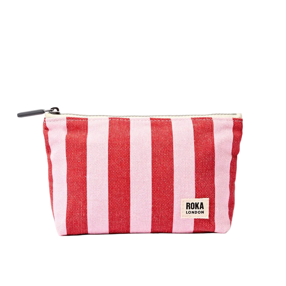 A small zippered pouch with vertical red and light pink stripes, featuring a white 'roka london' label on the front and a black zipper pull, set against a plain white background.