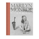 Book cover featuring a black and white photo of Marilyn Monroe with an umbrella on a beach and the title 'Marilyn Monroe A Portrait'.