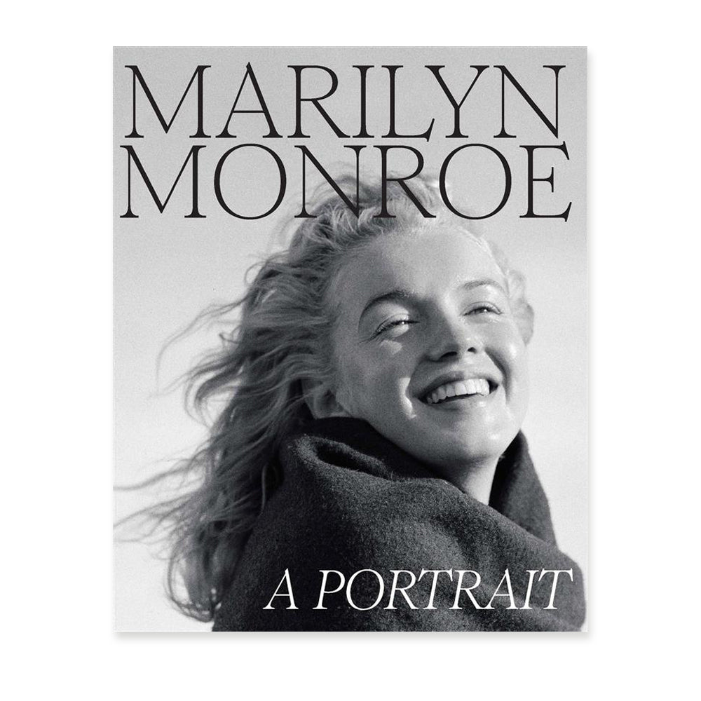 Book cover with a black and white photograph of marilyn monroe smiling and the title 'marilyn monroe a portrait'. 