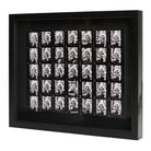 Side view of black and white contact sheet photographic print in a black frame.
