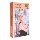 Side view of boxed jigsaw puzzle with a photograph of a Marilyn Monroe against a curtain.