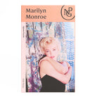 Boxed jigsaw puzzle with a photograph of a Marilyn Monroe against a curtain.