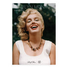 Exhibition poster for Marilyn Monroe: A Portrait, featuring a photograph of a woman laughing, wearing a necklace.