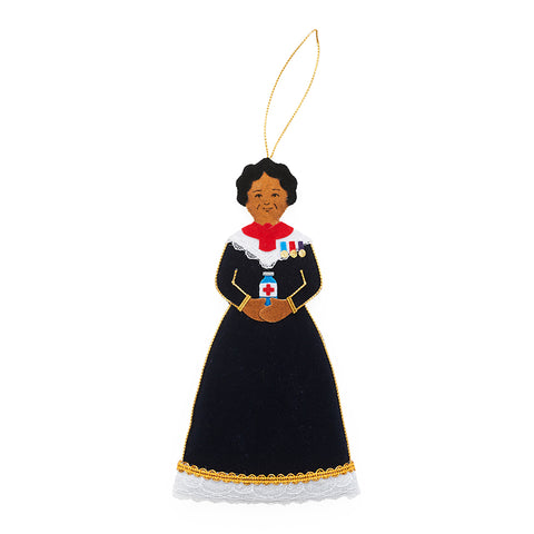 A fabric decoration of Mary Seacole in a black nurses dress.