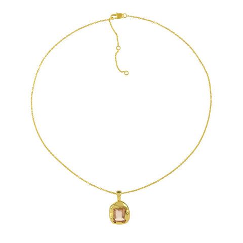 A thin gold chain necklace with a gold encased champagne stone pendant.