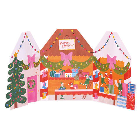 A fold out card to look like a colourful elves workshop. 