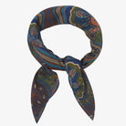 Colorful patterned scarf tied in a knot on a white background
