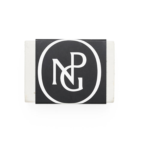 White eraser with a central band featuring the NPG monogram in black and white.