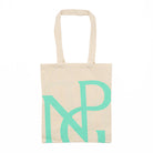 Neutral tone tote bag with the NPG monogram in green against a white background