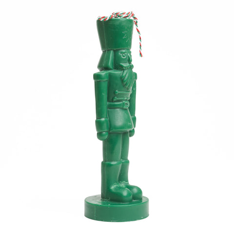 Green nutcracker candle, side view. 