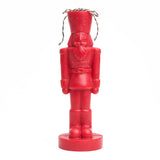 Red nutcracker shaped candle. 