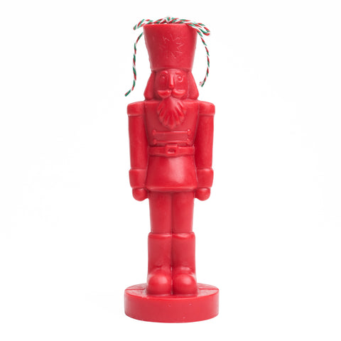 Red nutcracker shaped candle. 