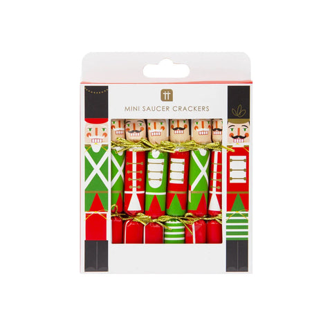 A box of 8 small green and red dressed nutcracker shaped Christmas crackers. 