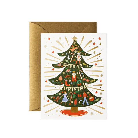 A white card with a fully decorated Christmas tree and 'Merry Christmas' written on a gold garland.