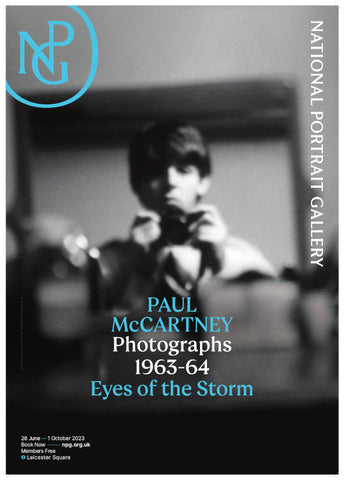 Paul McCartney 'Eyes of the Storm' exhibition poster featuring a black and white photograph of McCartney holding a camera. 