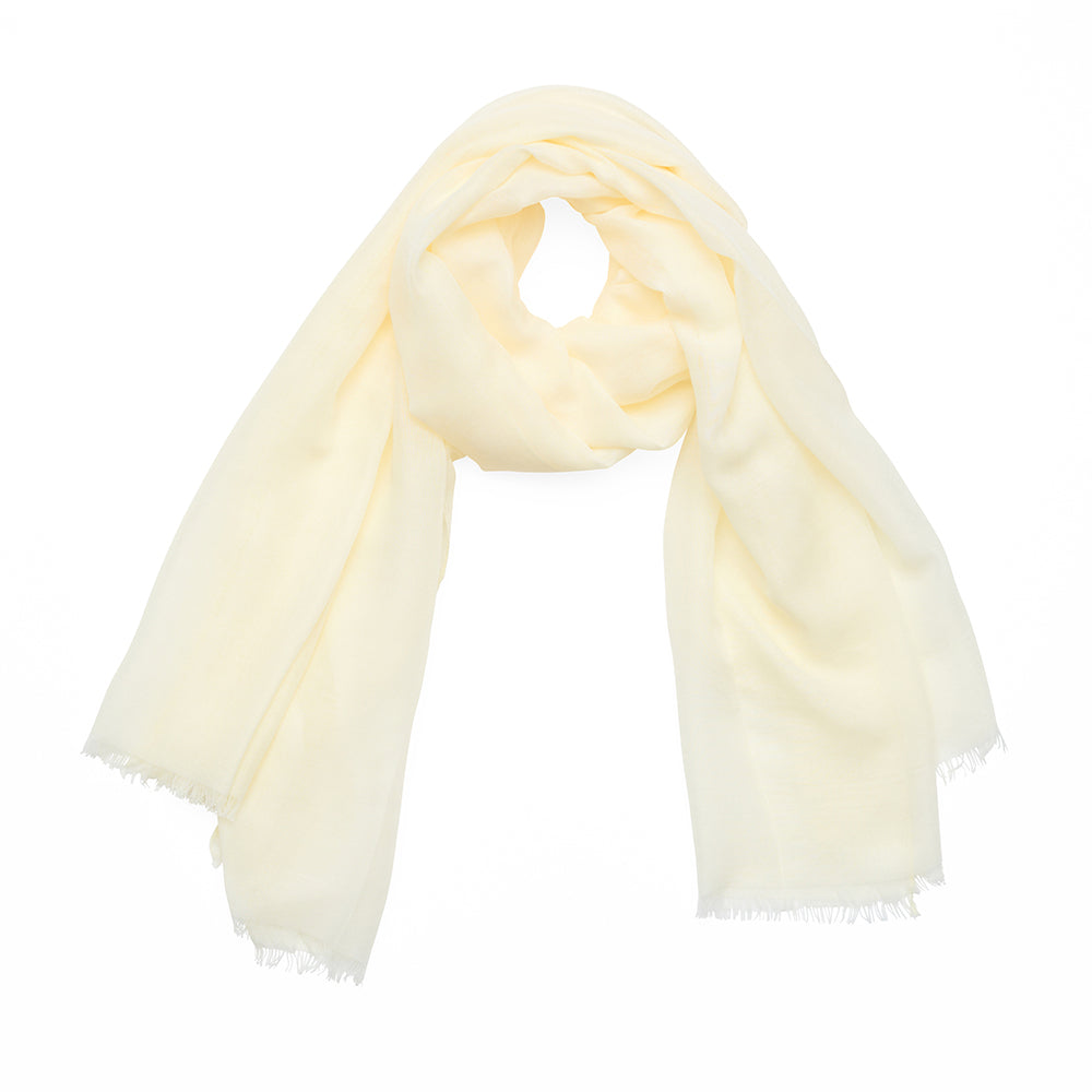 Cream coloured scarf on a white background