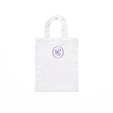 Reverse of white children's tote bag featuring the NPG monogram logo in purple.