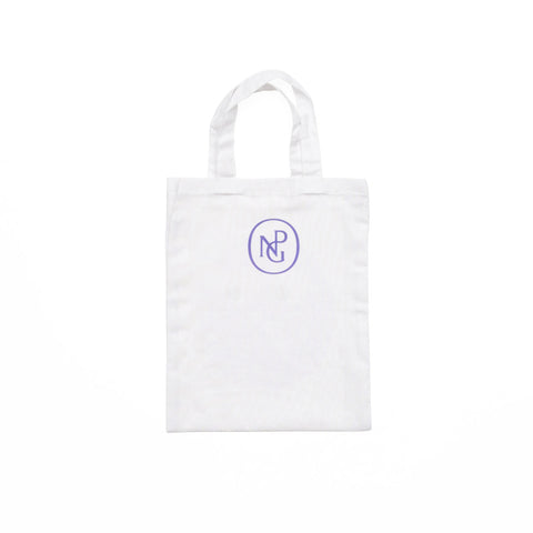 Reverse of white children's tote bag featuring the NPG monogram logo in purple.