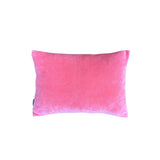 Reverse of rectangular cushion in a pink block colour. 