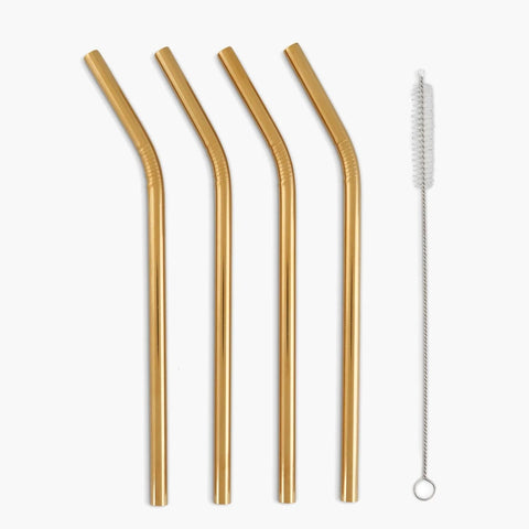 A set of four golden reusable straws with a small brush to clean them.