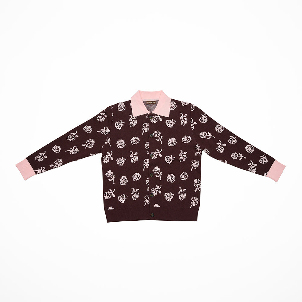 Brown cardigan with pink floral pattern and pink collar on a white background